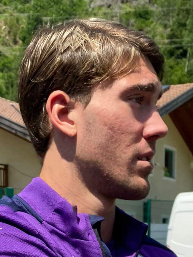 Serbian footballer Dušan Vlahović, forward of ACF Fiorentina, signs autographs during the preseason training camp in Moena, Italy, in the summer of 2021