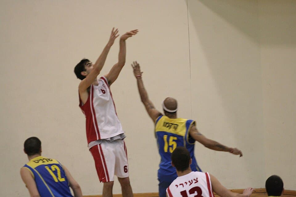 Hapoel Tel Aviv basketball players in action