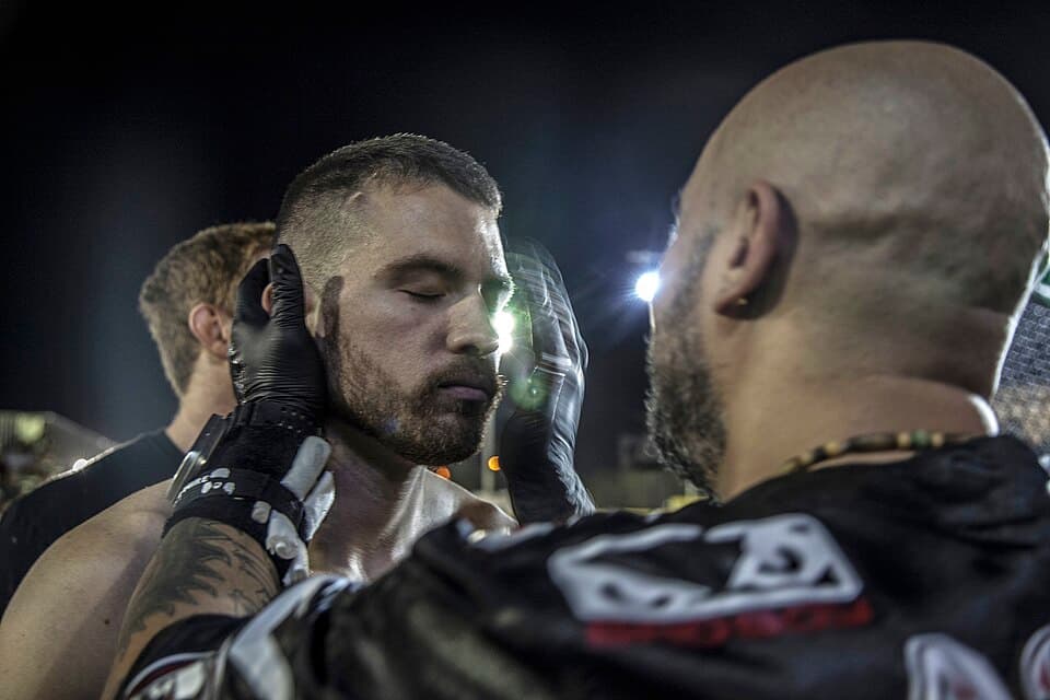 Steve Mulligan, an amateur fighter from Murietta, Calif., is checked by the ringside doctor after his victory in the octagon during the Mixed Martial Arts Fight Night Live at Del V