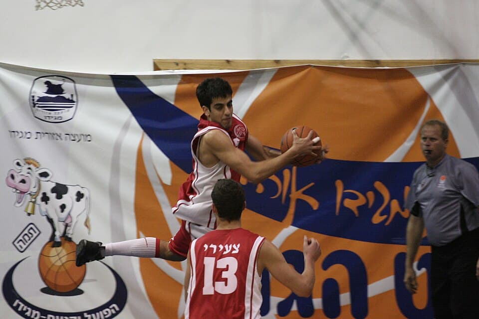 A basketball game in a kibbutz gym in the Jezreel Valley