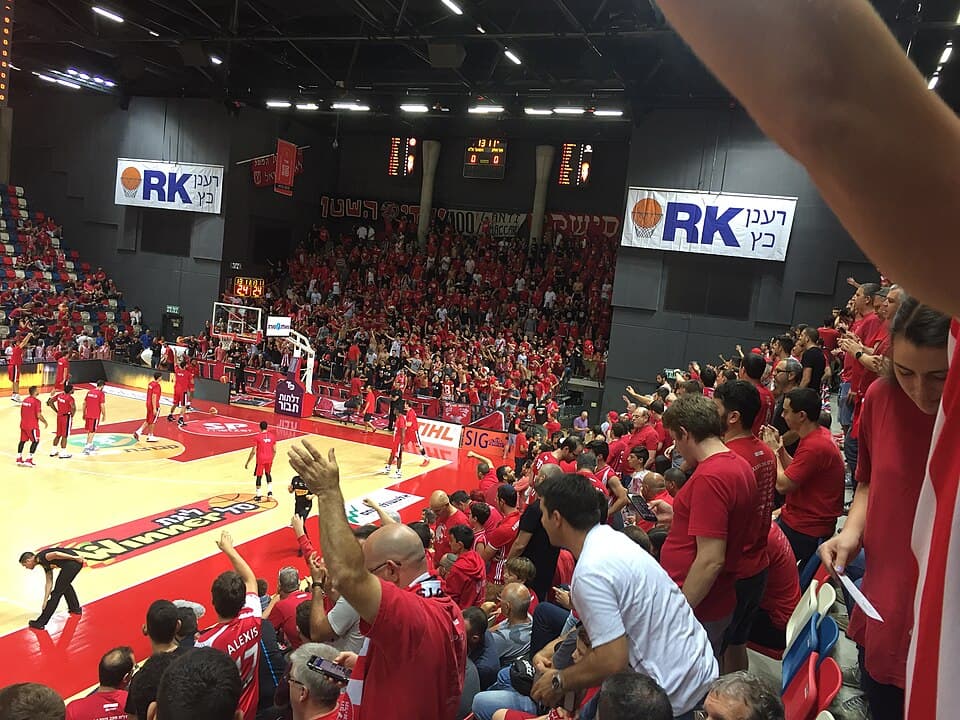 Hapoel Tel Aviv fans fill the arena in red before a home game