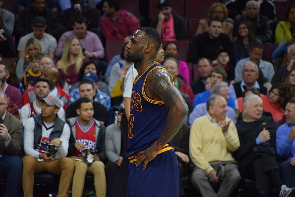LeBron James stands hands-on-hips in front of Philadelphia fans
