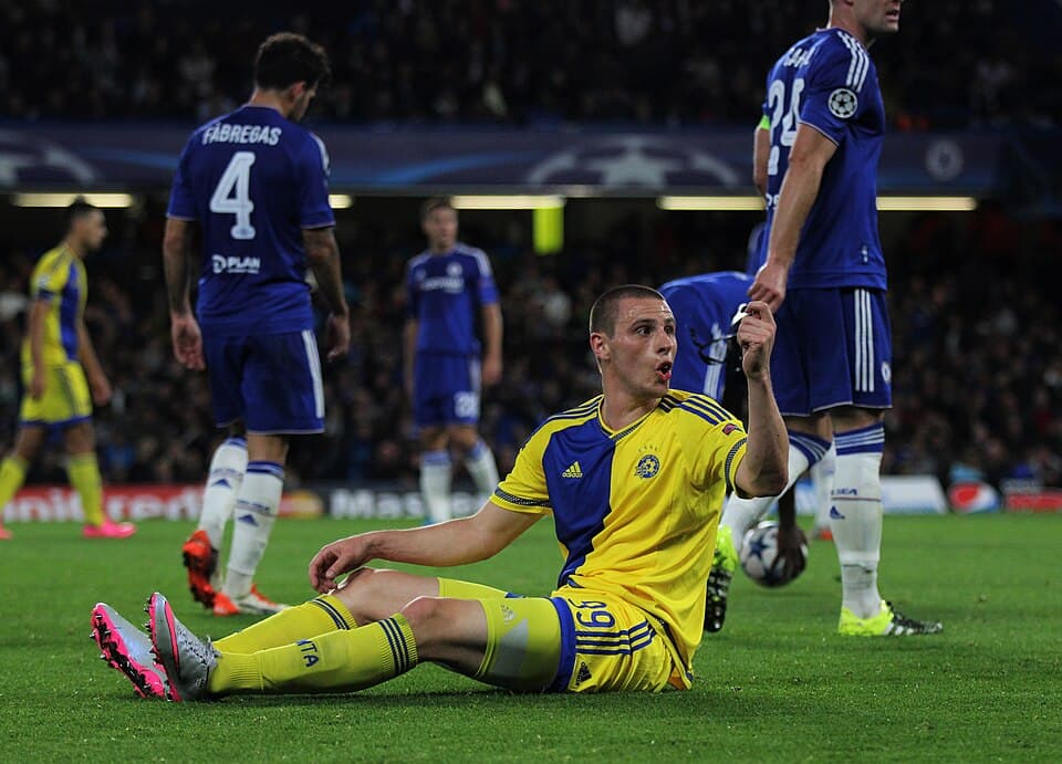 Dejan Radonjic of Maccabi Tel-Aviv pleads with the official for a card during the Champions League game against Chelsea