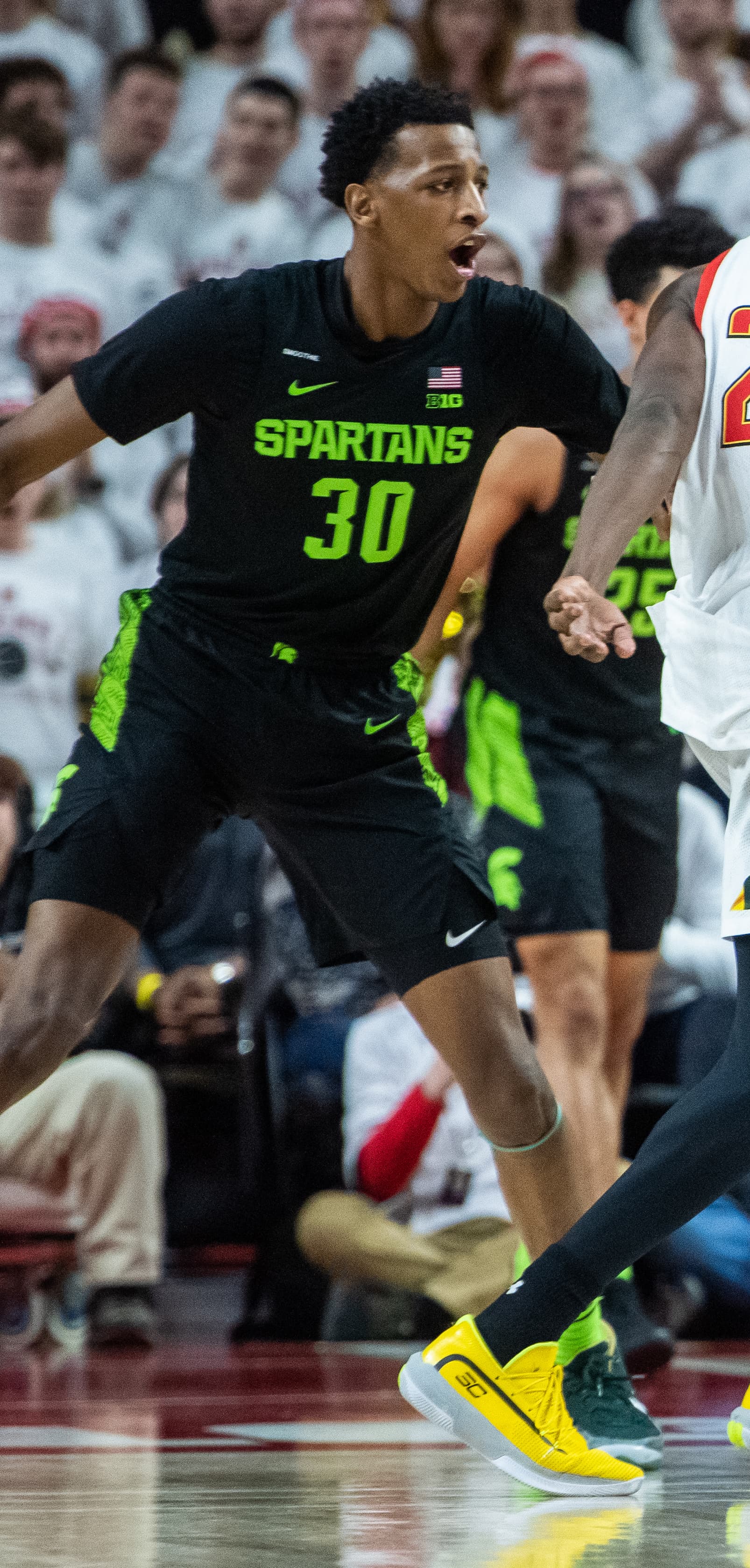 Marcus Bingham in green Michigan State kit during a college basketball game