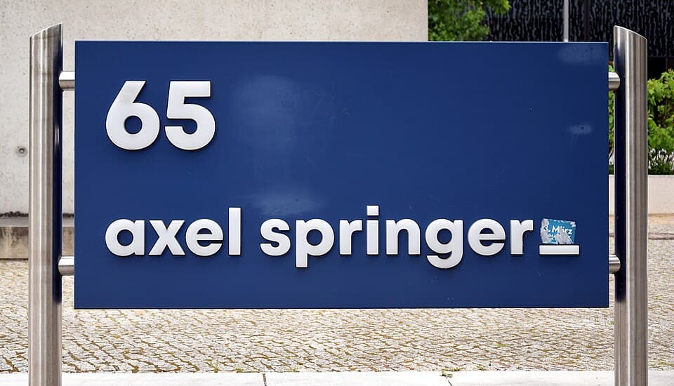 Plaque with the inscription " 65 Axel Springer" on the forecourt of the Axel Springer high-rise building on Axel-Springer-Strasse in Berlin-Kreuzberg, Germany