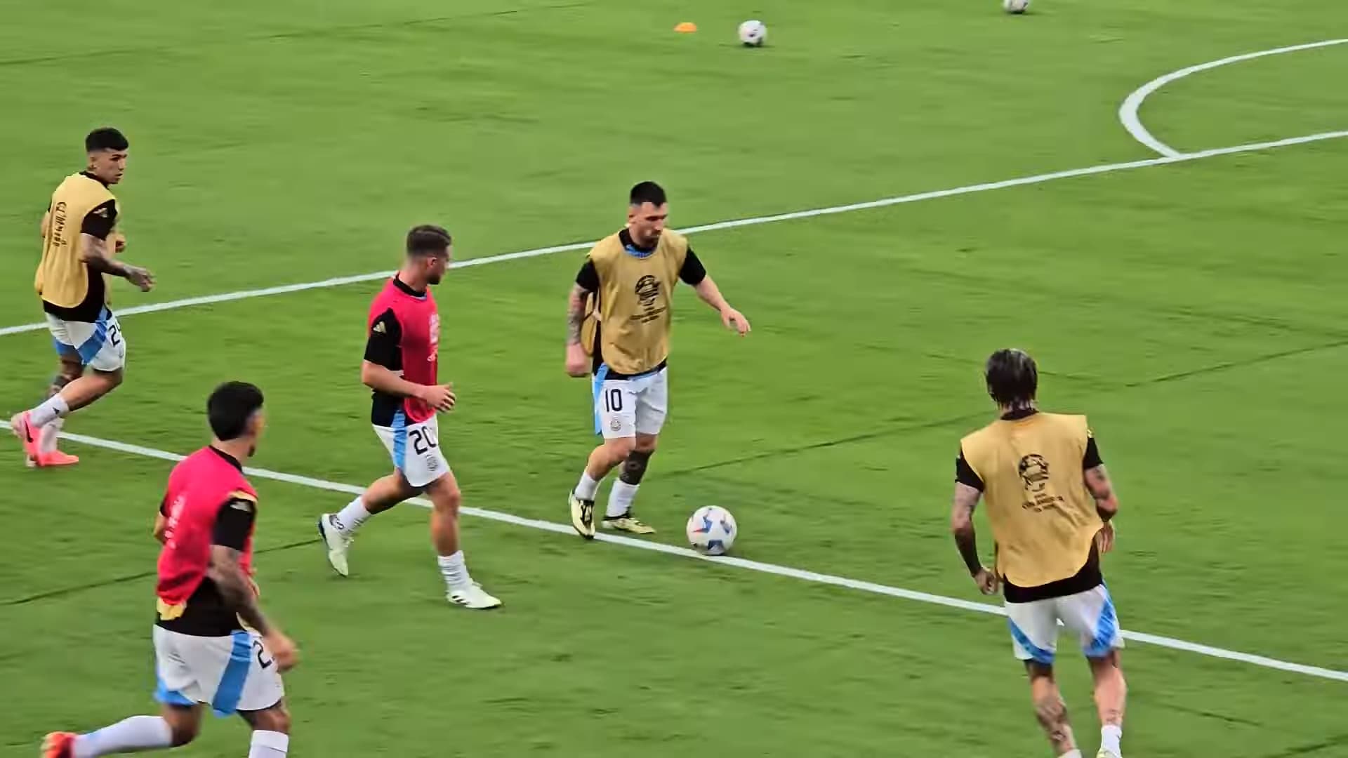 Lionel Messi warms up with Argentina teammates before a Copa América semi-final