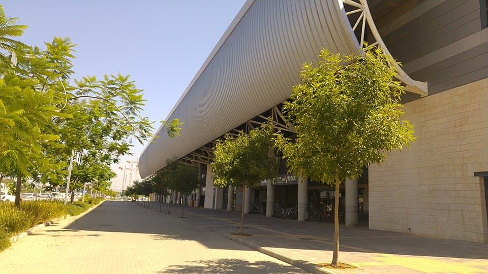 The exterior and curved roof of the HaMoshava Stadium in Petah Tikva